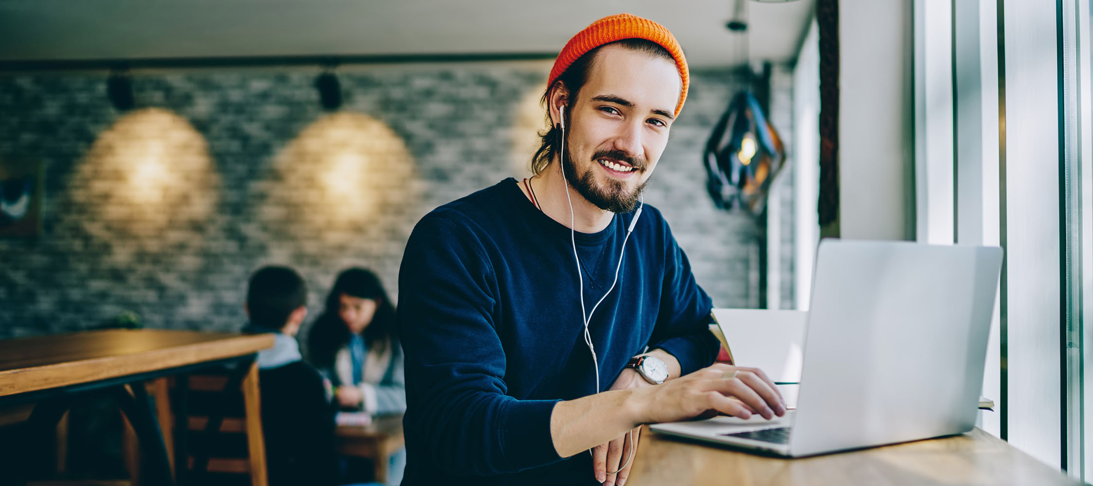 Portrait of happy smiling hipster guy enjoying time for favourit